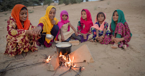 istock Indian children preparing chai - masala tea 2003585395