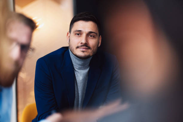istock Professional Man in Meeting with Colleagues in Focus 2003612527