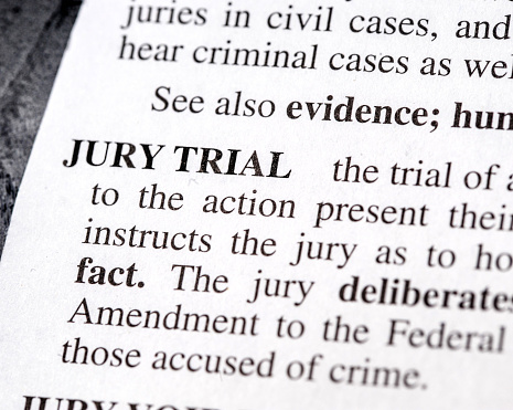close up photo of the words  jury trial