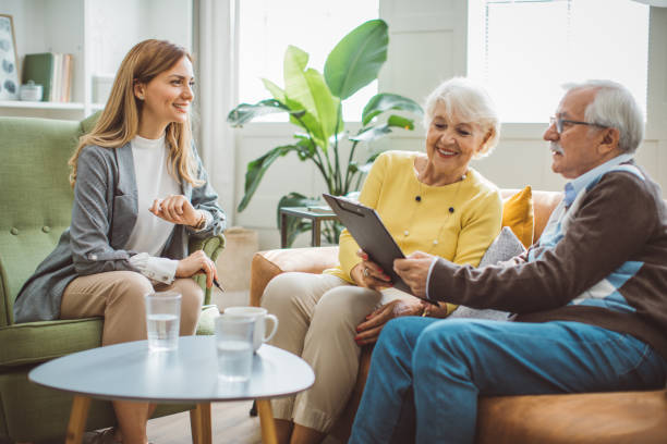 istock Senior couple consulting with insurance agent 2003684408