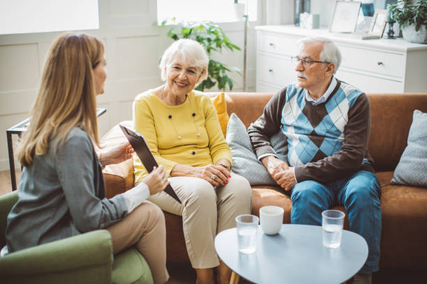 istock Senior couple consulting with insurance agent 2003684411