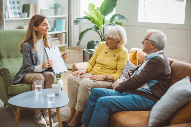 istock Senior couple consulting with insurance agent 2003684415