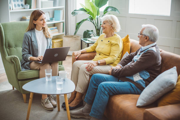 istock Senior couple consulting with insurance agent 2003684919