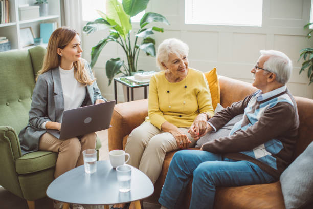 istock Senior couple consulting with insurance agent 2003684920