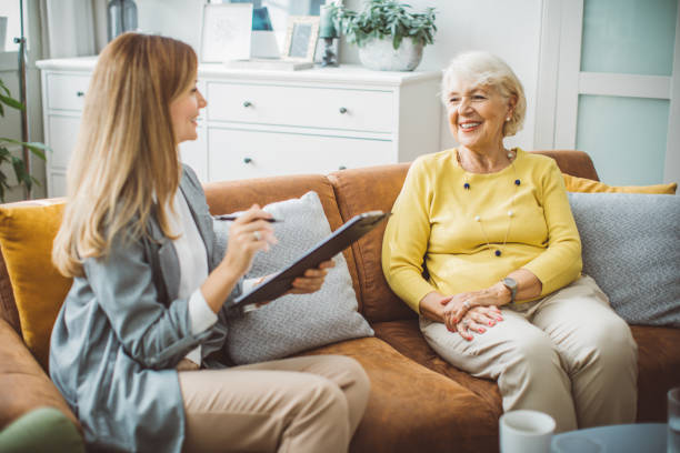 istock Senior woman consulting with insurance agent 2003685140