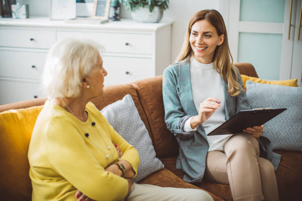 istock Senior woman consulting with insurance agent 2003685225