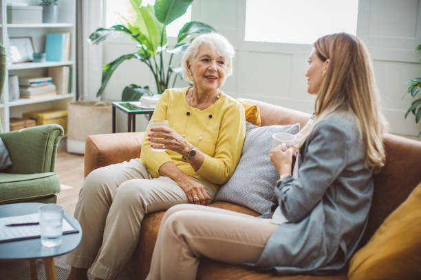istock Senior woman consulting with insurance agent 2003685486