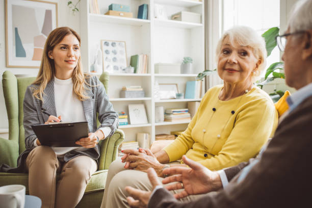 istock Senior couple consulting with insurance agent 2003686094