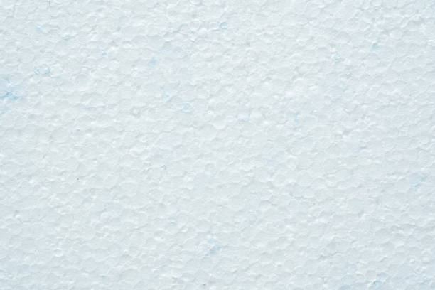 Simple white flat piece of styrofoam material structure background texture, seen from above, top view closeup detail shot, nobody Plain blank insulation styrofoam part backdrop, copy space, no people