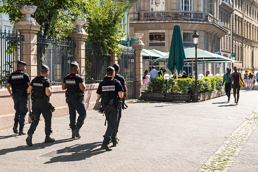 Strasbourg, France - Jul 29, 2017: Large group of male policeman's from Gendarmerie surveilling inspecting the streets of Strasbourg early in the morning in the central Place Broglie