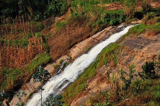 Gakoro, Gakenke district, Northern Province, Rwanda: Agasumo ka Mukinga waterfalls on the Mukinga river, surrounded by corn fields.