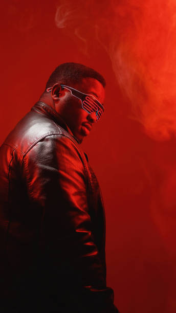 istock Color light portrait neon people man red smoke 2003814620