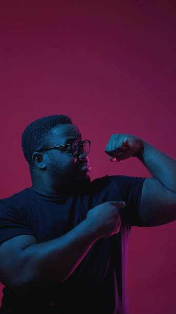 istock Showing power color light people confident man 2003814631