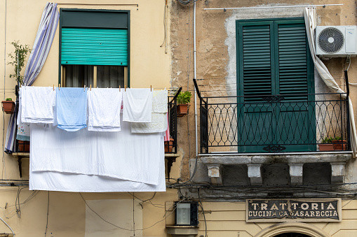 Palermo, Sicily, Italy Jan. 14, 2024 Bed sheets  hanging out to dry on a clothes line.