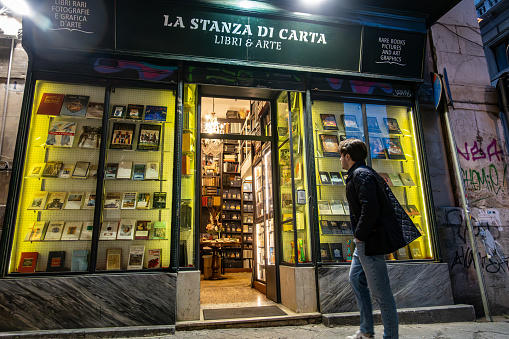 Palermo, Sicily, Italy Jan 19, 2024 pedestrians walk in front of a landmark rare book store, La Stanza Di Carta.