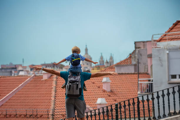 Father and son enjoy summer in Lisbon do sightseeing