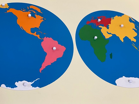 Montessori geography materials, such as the geography puzzle map and the globe.