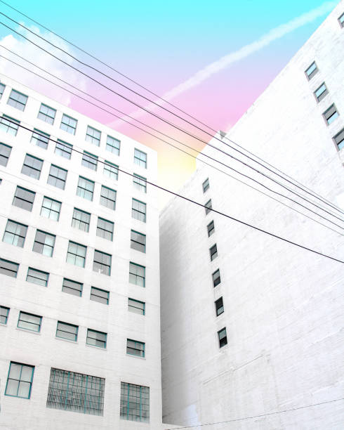 Looking up at a white building with a pastel sunset in Downtown Los Angeles, California