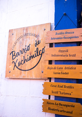 Xochimilco, Oaxaca, Mexico: A wooden sign at a tourist craft shop in Xochimilco, a neighborhood near downtown Oaxaca known for its arts and crafts and wall paintings.