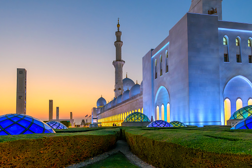 The Sheikh Zayed Grand Mosque, the largest mosque in the UAE, illuminated at twilight blue hour in Abu Dhabi, United Arab Emirates. The Sheikh Zayed Grand Mosque, the largest mosque in the UAE, illuminated at twilight blue hour in Abu Dhabi, United Arab Emirates.