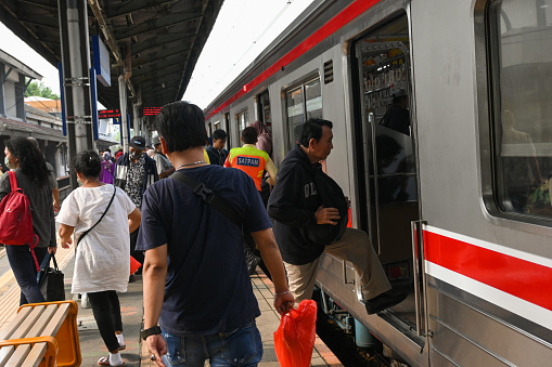 Jakarta, Indonesia - February 08 2024: pick-up and drop-off of commuterline KRL transport passengers on weekends