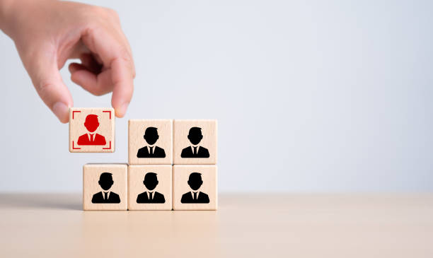 istock Target customer, marketing segmentation, buyer persona, job recruitment concept. Personalization marketing, customer centric strategies. Hand putting wooden cube with focused on target customer icon. 2004028178