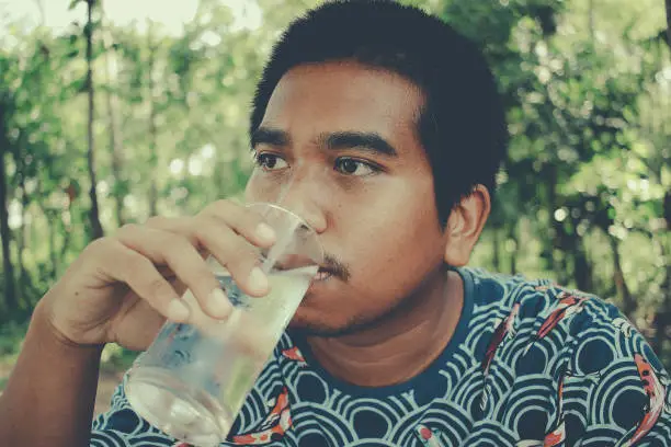 man drinking clean water