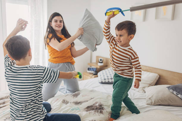 istock A Group Of Kids Fighting With Pillows And Foam Sword 2004101280