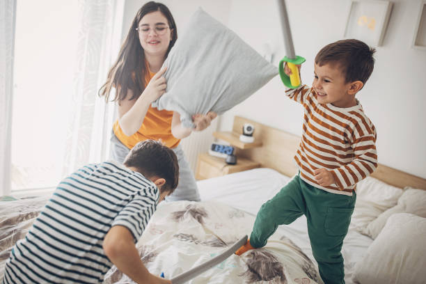 istock A Group Of Kids Fighting With Pillows And Foam Sword 2004110821