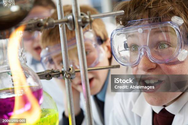 Schoolchildren Watching Experiment In Science Class Closeup Stock Photo - Download Image Now