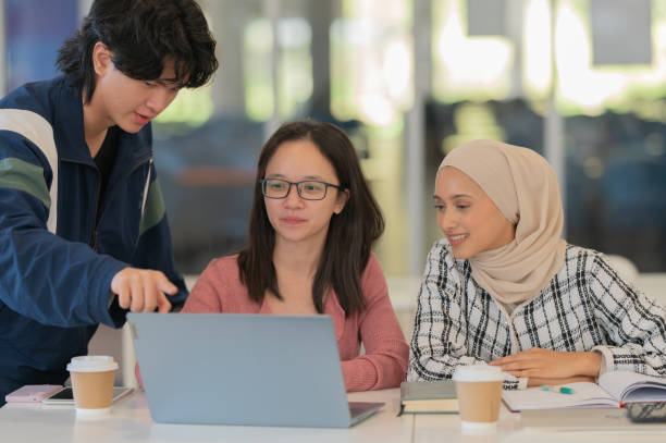istock Asian male & female university students having discussion 2004143878