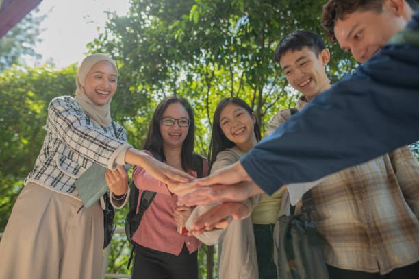 istock Group of Asian students hand together 2004144396