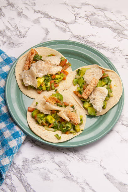 istock Mexican tacos Placeros with chicharron and guacamole. 2004172187