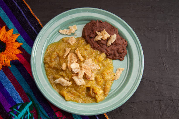 istock Mexican food; Chicharron with green sauce and refried beans 2004180461