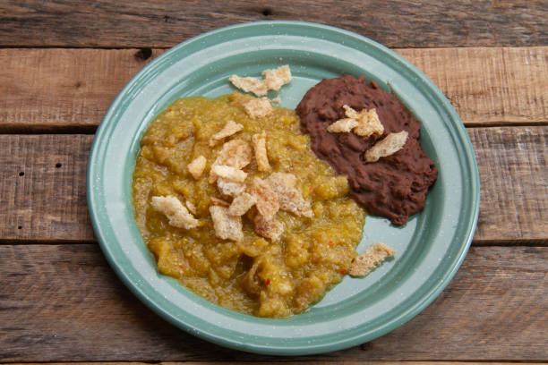 istock Mexican food; Chicharron with green sauce and refried beans 2004180975