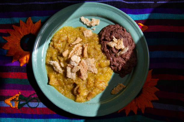Mexican food; Chicharron with green sauce and refried beans