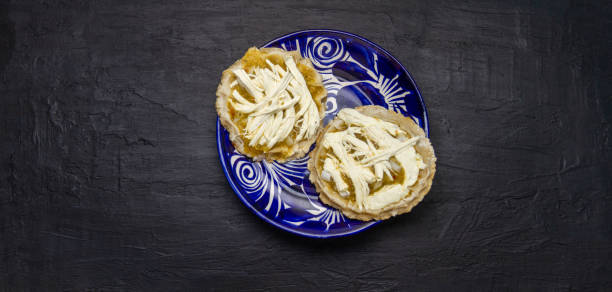 istock Flavorful Delight: Sopes with green sauce, cheese, and onion 2004185057