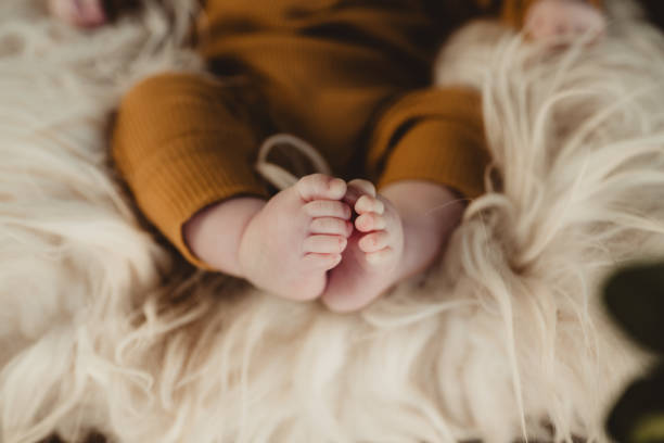 istock Baby toes on a blanket 2004191280