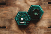 Diamond wedding ring in green velvet ring box