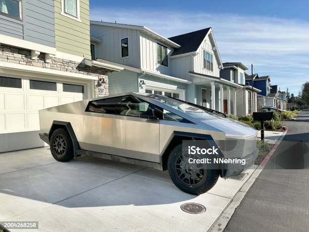 Tesla Cybertruck Parked In Driveway Stock Photo - Download Image Now - Cybertruck, Electric Car, Alternative Fuel Vehicle