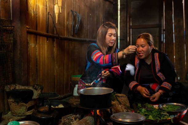 istock Hill tribes women cooking in traditional kitchen. 2004301196