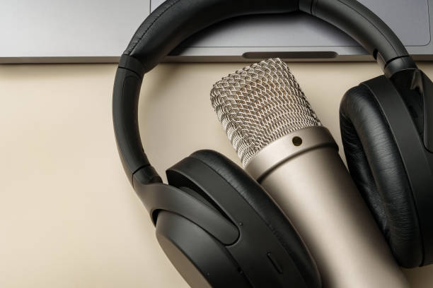 istock Headphones and microphone on the table close up 2004311132