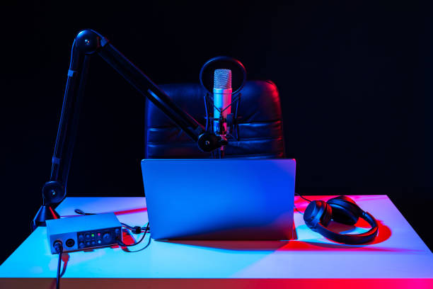 istock Home studio podcast interior. Microphone, table and chair 2004311133