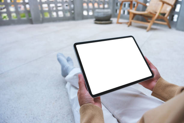 istock Mockup image of a woman working and typing on laptop computer with blank screen 2004319979