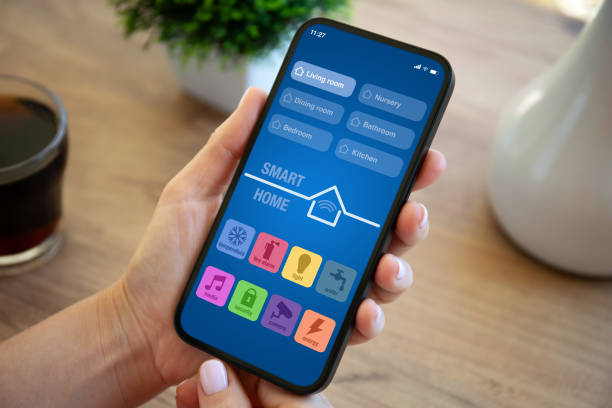 istock home, smart, house, woman, hand, kitchen, room, temperature, alarm, system, video, security, technology, internet, connection, clever, control, computer, wireless, key, thermostat, phone, interface, electronic, lamp, tablet, table, remote, touch, display, 2004322606