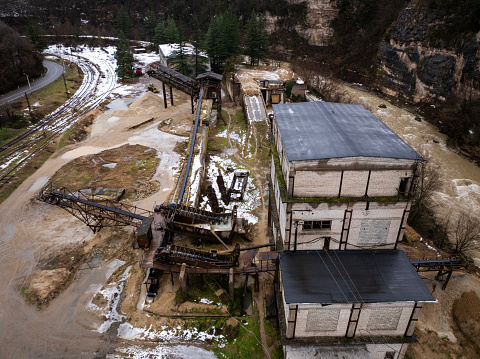 Aerial view of old abandoned manganese mine building in Chiatura, Georgia. Taken via drone.