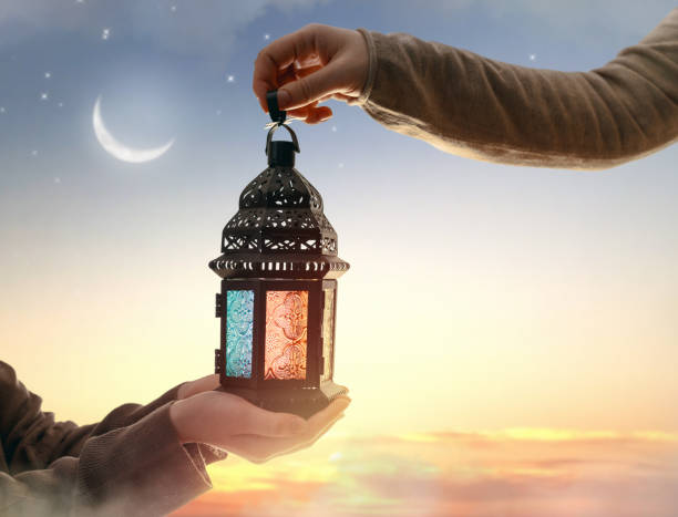 istock Ornamental Arabic lantern with burning candle 2004367560