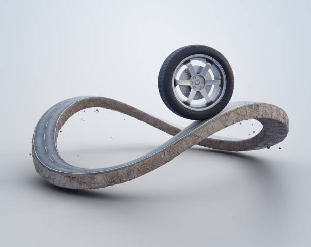 Car wheel on earth land with asphalt driveway.