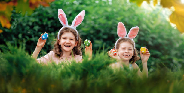 istock children with painting eggs outdoors 2004387968