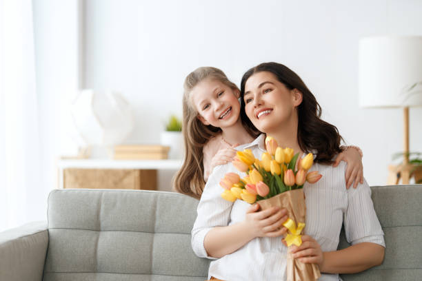 istock daughter and mom with flowers 2004397564